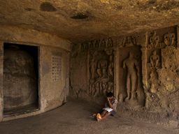 Boy studying at Mahakali Caves.