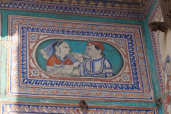 A fresco from a mansion, or haveli, depicting the sharing of a drink. In Rajput culture, the munawwar piyala meaning "cup of request" is liquor offered to guests during gatherings, especially marriages.